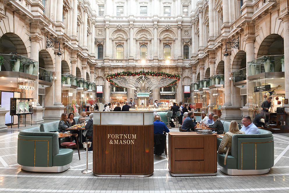 Afternoon Tea Spots in the City of London - Fortnum’s Bar at The Royal Exchange - grand covered courtyard with soft seating and decorative bar Afternoon Tea Spots in the City of London - Fortnum’s Bar at The Royal Exchange - grand covered courtyard with soft seating and decorative bar