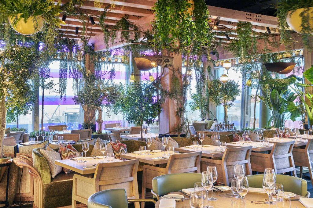 11 Rooftop Bars & Restaurants in the City of London - 14 Hills 14 Hills - glamorous restaurant - dinning room with plants hanging in pots from the ceiling