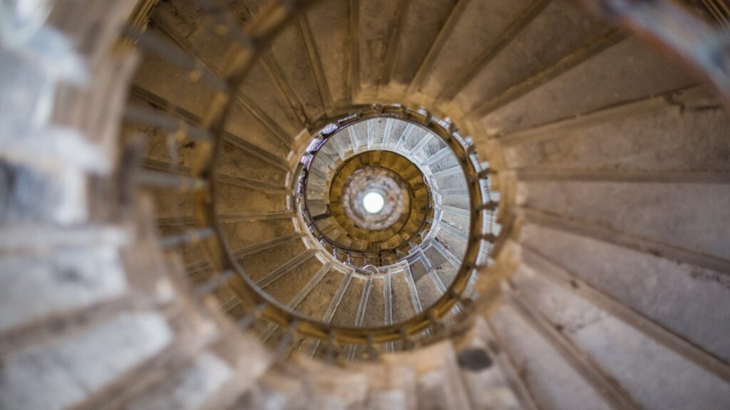 Aerial view of a swirling stone staircase.