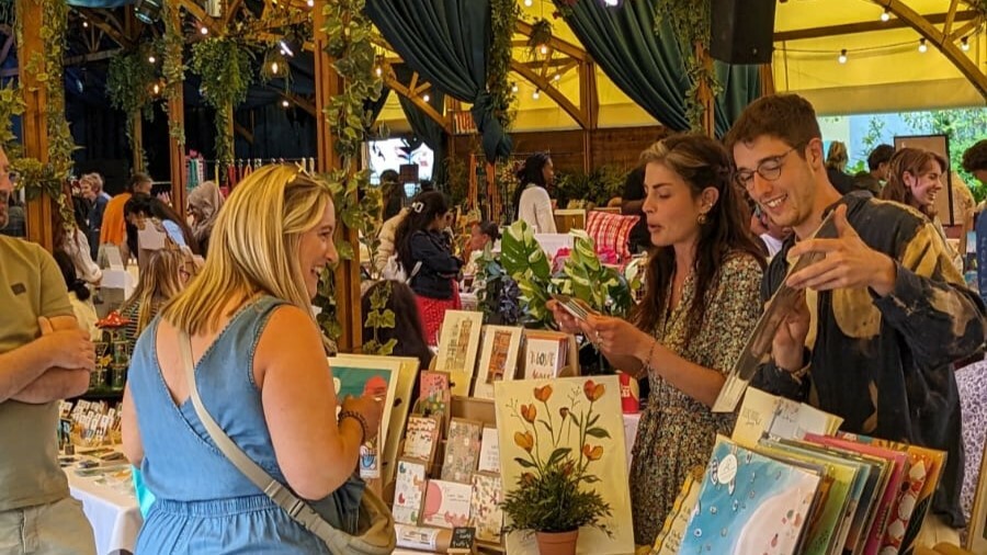 Person browsing a craft stall