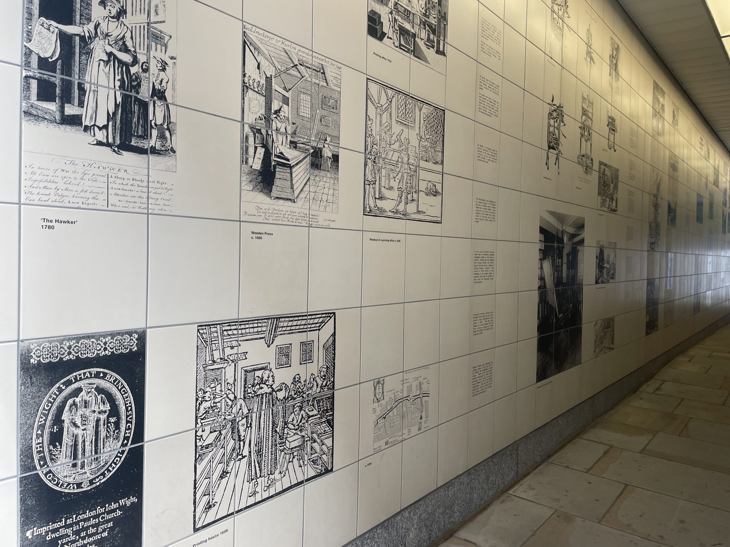 Tiles depicting the history of the written word in fleet street in Magpie Alley.