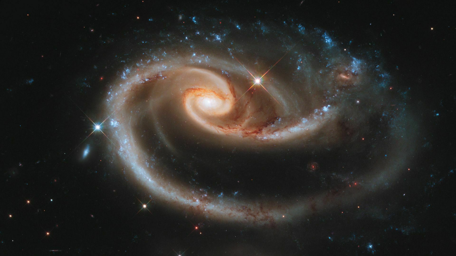 This Hubble Space Telescope image shows a group of interacting galaxies called Arp 273.