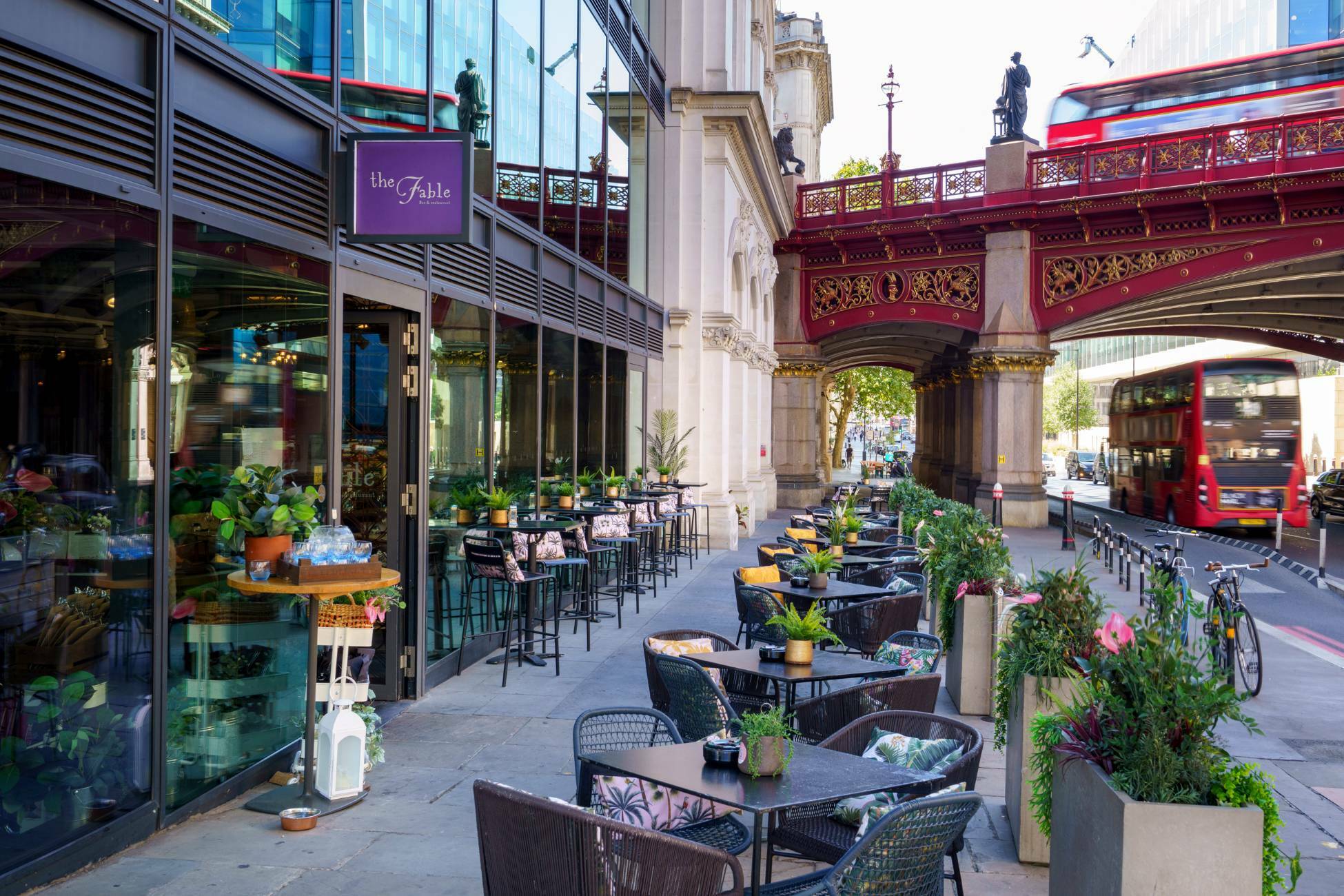 The outside of The Fable with seating along the street